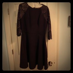 Black dress with lace sleeves.